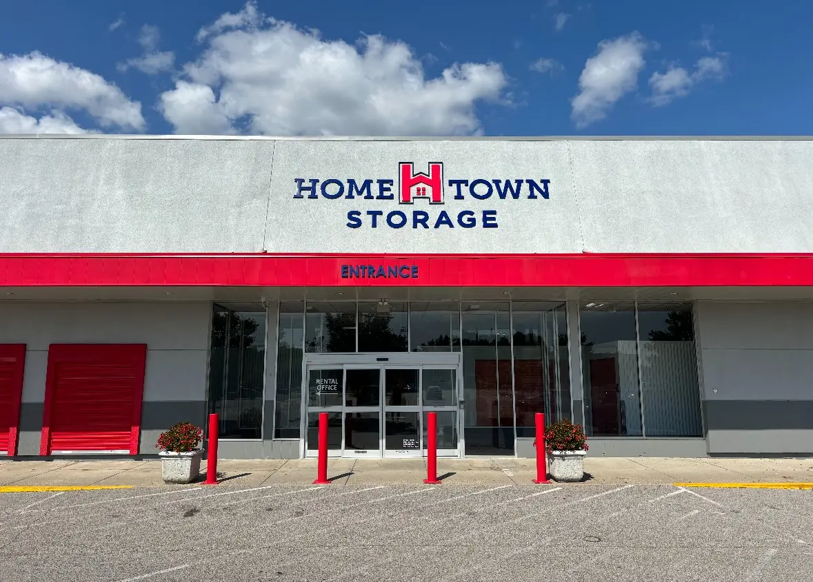 Front view of Hometown Storage in New Albany, featuring a bold red and white facade with clear signage. The facility offers climate-controlled self-storage options, ensuring a safe and secure environment for sensitive items.